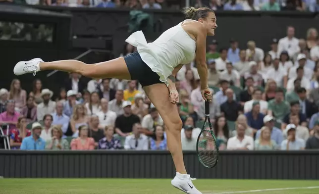 Aryna Sabalenka of Belarus serves to Emma Raducanu of Britain during a third round women's singles match at the Wimbledon Tennis Championships in London, Friday, July 4, 2025. (AP Photo/Kin Cheung)