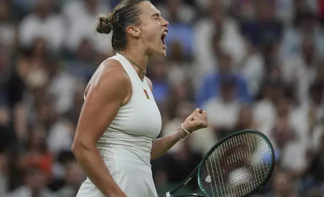 Aryna Sabalenka of Belarus reacts after winning a point against Emma Raducanu of Britain during a third round women's singles match at the Wimbledon Tennis Championships in London, Friday, July 4, 2025. (AP Photo/Kin Cheung)