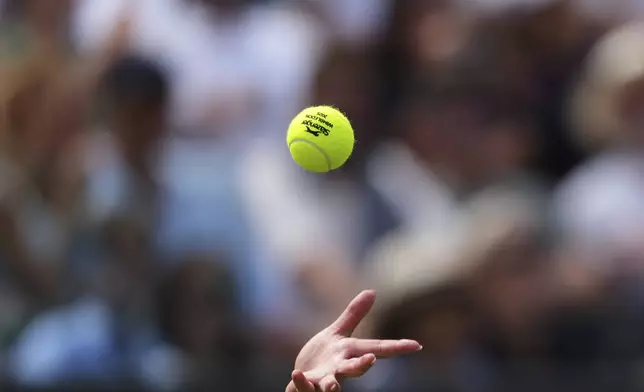 Amanda Anisimova of the U.S. serves during her women's singles third round match against Dalma Galfi of Hungary at the Wimbledon Tennis Championships in London, Friday, July 4, 2025.(AP Photo/Joanna Chan)