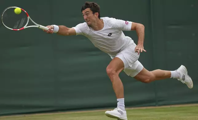 Sebastian Ofner of Austria returns to Grigor Dimitrov of Bulgaria during a third round men's singles match at the Wimbledon Tennis Championships in London, Saturday, July 5, 2025. (AP Photo/Joanna Chan)
