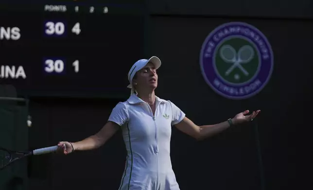 Elina Svitolina of Ukraine reacts during her women's singles third round match against Elise Mertens of Belgium at the Wimbledon Tennis Championships in London, Friday, July 4, 2025.(AP Photo/Joanna Chan)