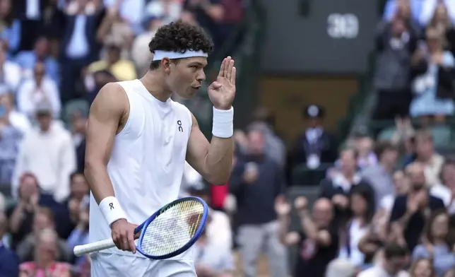 Ben Shelton of the U.S. celebrates after beating Marton Fucsovics of Hungary during their men's singles third round match at the Wimbledon Tennis Championships in London, Saturday, July 5, 2025.(AP Photo/Alastair Grant)