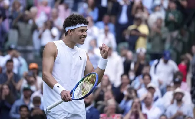 Ben Shelton of the U.S. celebrates after beating Marton Fucsovics of Hungary during their men's singles third round match at the Wimbledon Tennis Championships in London, Saturday, July 5, 2025.(AP Photo/Alastair Grant)