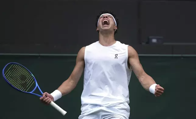 Ben Shelton of the U.S. celebrates after beating Marton Fucsovics of Hungary during their men's singles third round match at the Wimbledon Tennis Championships in London, Saturday, July 5, 2025.(AP Photo/Alastair Grant)