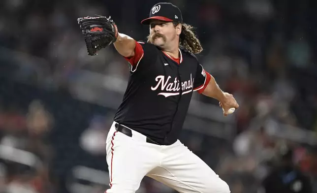 Washington Nationals pitcher Andrew Chafin throws during the sixth inning of a baseball game against the Cincinnati Reds in Washington, Monday, July 21, 2025. (AP Photo/Terrance Williams)