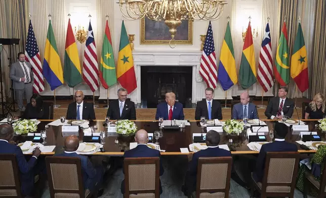 President Donald Trump speaks with African leaders including Senegalese President Bassirou Diomaye Faye, Liberian President Joseph Nyuma Boakai, Bissau-Guinean President Umaro Sissoco Embal€, Mauritanian President Mohamed Ould Ghazouani and Gabonese President Brice Oligui Nguema during a lunch in the State Dining Room of the White House, Wednesday, July 9, 2025, in Washington. (AP Photo/Evan Vucci)