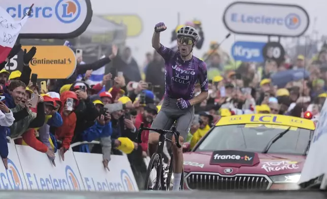 Australia's Ben O'Connor crosses the finish line to win the eighteenth stage of the Tour de France cycling race over 171.5 kilometers (106.6 miles) with start in Vif and finish in Courchevel Col de la Loze, France, Thursday, July 24, 2025. (AP Photo/Mosa'ab Elshamy)
