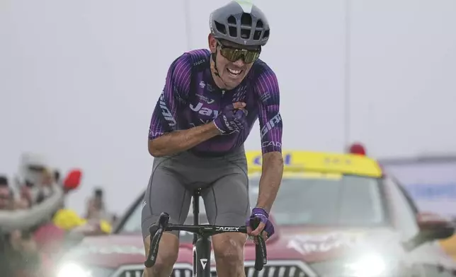 Australia's Ben O'Connor crosses the finish line to win the eighteenth stage of the Tour de France cycling race over 171.5 kilometers (106.6 miles) with start in Vif and finish in Courchevel Col de la Loze, France, Thursday, July 24, 2025. (AP Photo/Mosa'ab Elshamy)