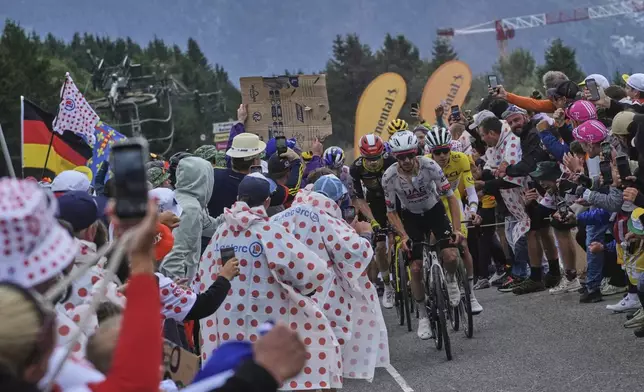 Britain's Adam Yates sets the pace for his leader Slovenia's Tadej Pogacar, wearing the overall leader's yellow jersey, followed by Denmark's Jonas Vingegaard during the eighteenth stage of the Tour de France cycling race over 171.5 kilometers (106.6 miles) with start in Vif and finish in Courchevel Col de la Loze, France, Thursday, July 24, 2025. (AP Photo/Thibault Camus)