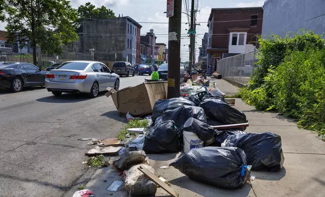 Trash sits on sidewalk along Cumberland and Fairhill Street on Tuesday, July 1, 2025 in Philadelphia, Pa. (Alejandro A Alvarez /The Philadelphia Inquirer via AP)