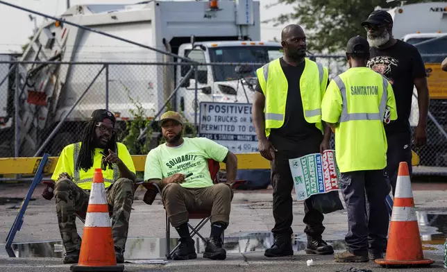 Philadelphia municipal workers, AFSCME District Council 33, strike outside the Sanitation Division, on Tuesday, July 1, 2025 in Philadelphia, Pa. (Alejandro A Alvarez /The Philadelphia Inquirer via AP)