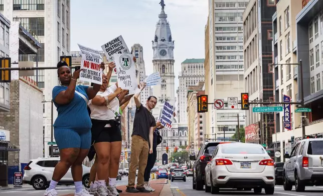 Philadelphia municipal workers, AFSCME District Council 33, strike outside police headquarters on Tuesday, July 1, 2025 in Philadelphia, Pa. (Alejandro A Alvarez /The Philadelphia Inquirer via AP)