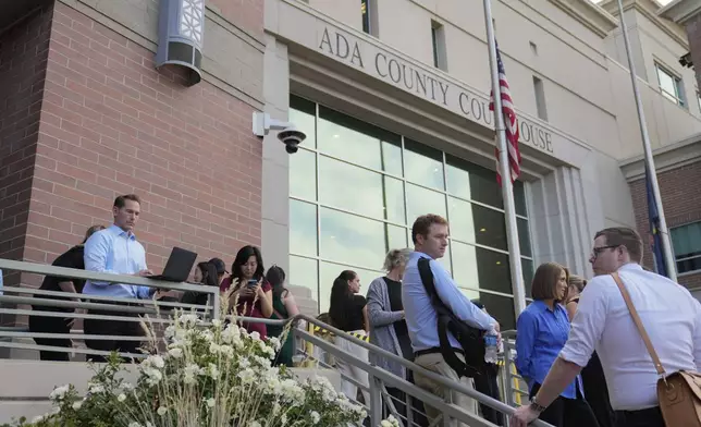 People wait in line to get seats for the Bryan Kohberger plea deal hearing outside the Ada County Courthouse on Wednesday, July 2, 2025, in Boise, Idaho. (AP Photo/Jenny Kane)