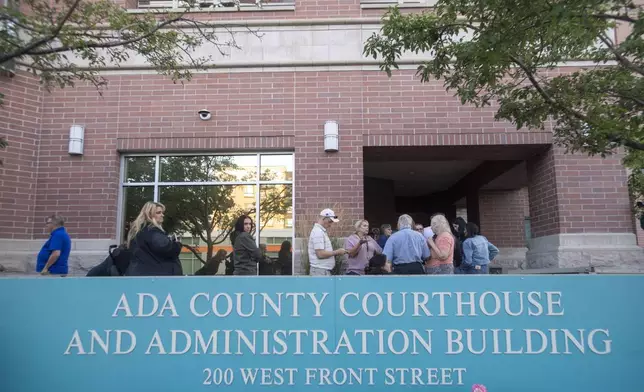 People wait in line outside the Ada County Courthouse for the Bryan Kohberger sentencing, Wednesday, July 23, 2025, in Boise, Idaho. (AP Photo/Drew Nash)