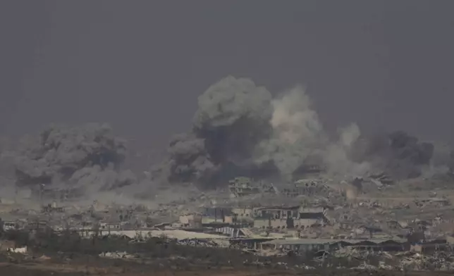 Smoke rises from an explosion in the northern Gaza Strip, as seen from southern Israel Sunday, July 27, 2025. (AP Photo/Ohad Zwigenberg)