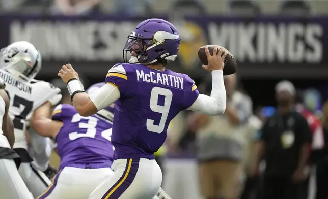 FILE - Minnesota Vikings quarterback J.J. McCarthy (9) throws a pass during the first half of an NFL preseason football game against the Las Vegas Raiders, Aug. 10, 2024, in Minneapolis. (AP Photo/Charlie Neibergall, file)