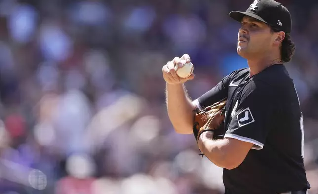Chicago White Sox relief pitcher Mike Vasil reacts after walking Colorado Rockies' Michael Toglia to load the bases in the seventh inning of a baseball game Sunday, July 6, 2025, in Denver. (AP Photo/David Zalubowski)
