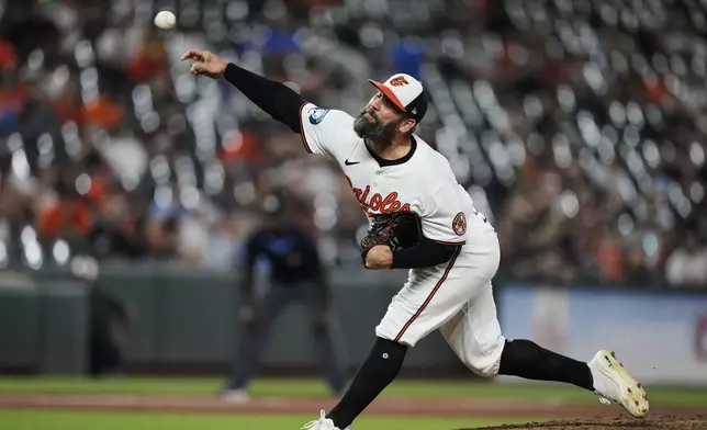 Baltimore Orioles relief pitcher Andrew Kittredge delivers during the eighth inning in the second baseball game of a doubleheader against the Toronto Blue Jays, Tuesday, July 29, 2025, in Baltimore. (AP Photo/Stephanie Scarbrough)