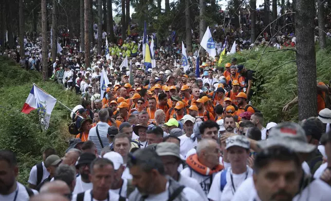 Participants in the "March of Peace" march in memory of the 1995 Srebrenica massacre, in Nezuk, Bosnia, Tuesday, July 8, 2025. (AP Photo/Armin Durgut)