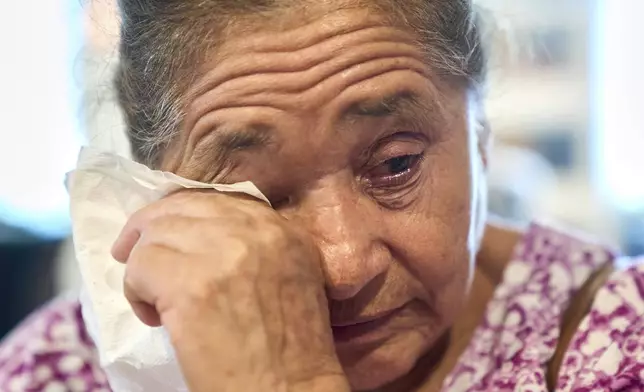 Maria Isabel de Perez, 82, of Welasco, Texas, cries as she recounts how her son was too scared to go to a hospital when he felt intense pain in his abdomen recently, leading to his near-death when his appendix burst, after she attended a diabetes clinic hosted by Holy Family Services, a birth center and women's clinic in the Rio Grande Valley, Wednesday, June 18, 2025, in Weslaco, Texas. (AP Photo/Jacquelyn Martin)