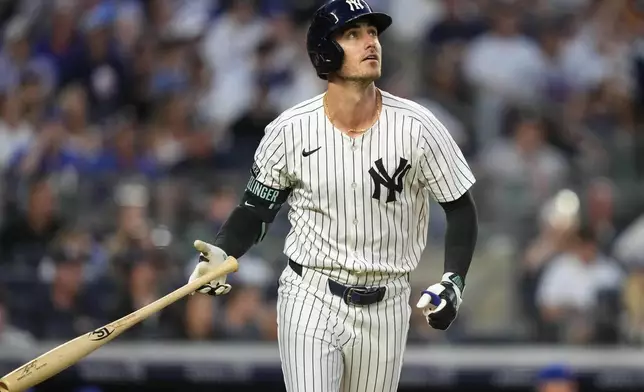 New York Yankees' Cody Bellinger watches his home run during the fifth inning of a baseball game against the Chicago Cubs, Friday, July 11, 2025, in New York. (AP Photo/Yuki Iwamura)