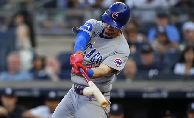 Chicago Cubs' Kyle Tucker hits a single during the first inning of a baseball game against the New York Yankees, Friday, July 11, 2025, in New York. (AP Photo/Yuki Iwamura)