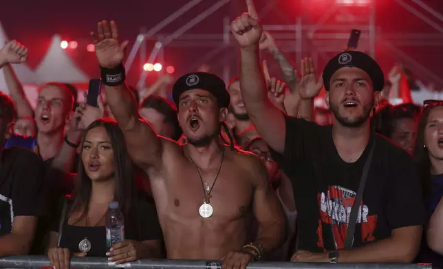 Fans attend a concert by Marko Perkovic, the right-wing singer notorious for his perceived sympathy for Croatia's World War II pro-Nazi puppet regime, in Zagreb, Croatia, Saturday, July 5, 2025. (AP Photo)