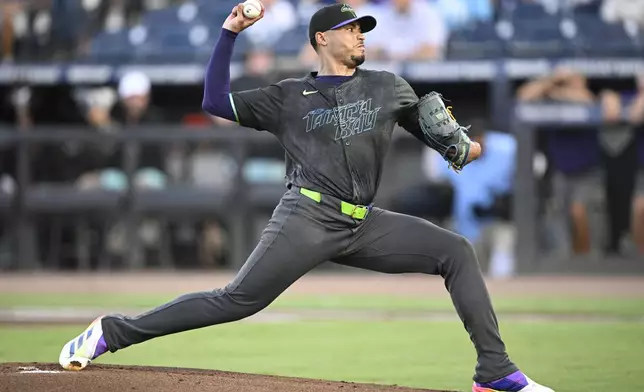 Tampa Bay Rays starting pitcher Taj Bradley throws to home plate during the first inning of a baseball game against the Baltimore Orioles, Friday, July 18, 2025, in Tampa, Fla. (AP Photo/Phelan M. Ebenhack)