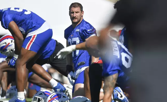 Buffalo Bills defensive end Joey Bosa (97) warms up during practice at the team’s NFL football training camp, Wednesday, July 23, 2025, in Pittsford, N.Y. (AP Photo/Adrian Kraus)