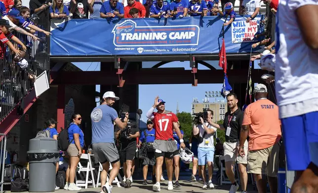 Buffalo Bills quarterback Josh Allen (17) walks to the field before practice at the team’s NFL football training camp, Wednesday, July 23, 2025, in Pittsford, N.Y. (AP Photo/Adrian Kraus)