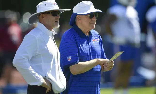 Buffalo Bills head coach Sean McDermott, left, and team owner Terry Pegula watch practice at the team's NFL football training camp, Wednesday, July 23, 2025, in Pittsford, N.Y. (AP Photo/Adrian Kraus)