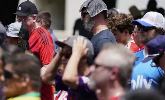 FILE - Soccer fans wait in line to enter Bank of America Stadium for a Club World Cup game, June 24, 2025, in Charlotte, N.C. (AP Photo/Erik Verduzco, File)