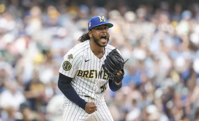 Milwaukee Brewers starting pitcher Freddy Peralta reacts after the fifth inning of a baseball game against the Miami Marlins, Friday, July 25, 2025, in Milwaukee. (AP Photo/Jeffrey Phelps)