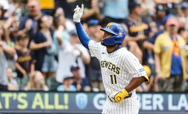 Milwaukee Brewers' Jackson Chourio reacts after hitting a home run against the Miami Marlins during the fourth inning of a baseball game Friday, July 25, 2025, in Milwaukee. (AP Photo/Jeffrey Phelps)