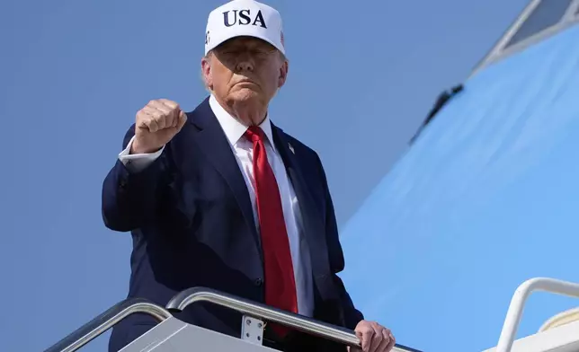 President Donald Trump gestures as he boards Air Force One, Thursday, July 3, 2025, at Joint Base Andrews, Md. (AP Photo/Alex Brandon)