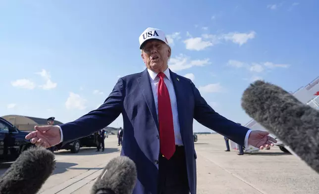 President Donald Trump talks to reporters before boarding Air Force One, Thursday, July 3, 2025, at Joint Base Andrews, Md. (AP Photo/Alex Brandon)