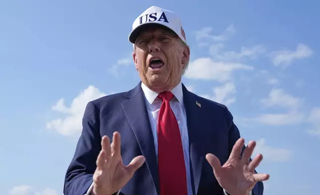 President Donald Trump talks to reporters before boarding Air Force One, Thursday, July 3, 2025, at Joint Base Andrews, Md. (AP Photo/Alex Brandon)