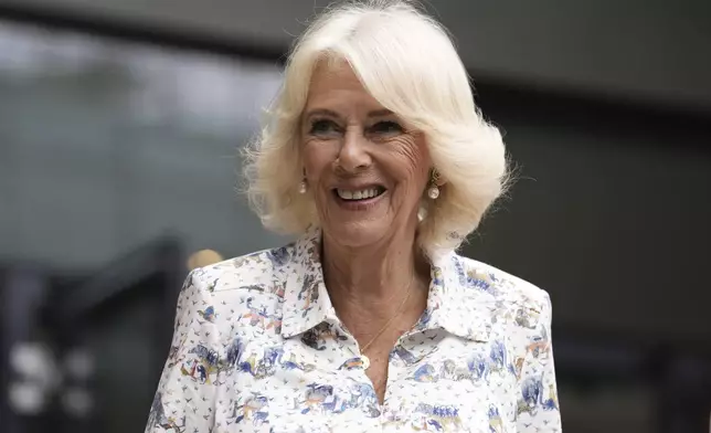 Britain's Queen Camilla arrives at the All England Lawn Tennis and Croquet Club on day ten of the 2025 Wimbledon Championships, Wednesday July 9, 2025. (Jordan Pettitt/PA via AP, Pool)
