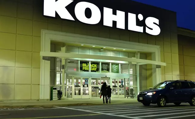 FILE - A pair of shoppers arrive at a Kohl's, Nov. 26, 2021, in Everett, Mass. (AP Photo/Josh Reynolds, file)