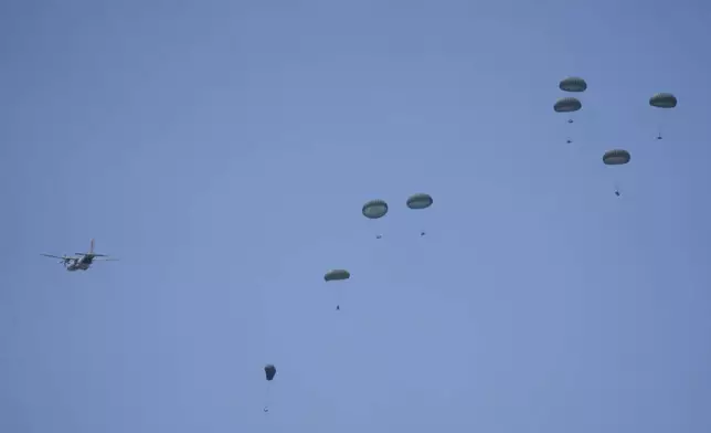 Humanitarian aid is airdropped to Palestinians over Deir al-Balah, central Gaza Strip Wednesday, July 30, 2025. (AP Photo/Abdel Kareem Hana)
