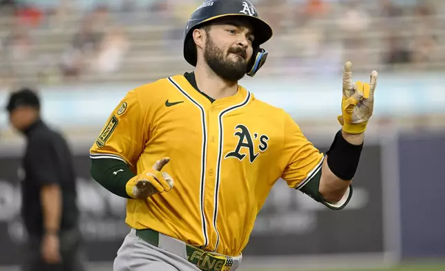 Athletics' Shea Langeliers rounds the bases after his three-run home run during the first inning of a baseball game against the Tampa Bay Rays, Monday, June 30, 2025, in Tampa, Fla. (AP Photo/Jason Behnken)