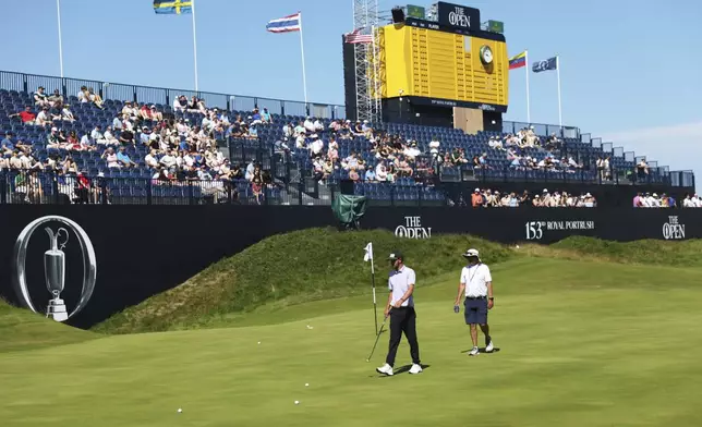 Amateur golfer Frazer Jones of England on the 18th green during a practice round for the 2025 British Open golf championship at Royal Portrush Golf Club, Northern Ireland, Sunday, July 13, 2025. (AP Photo/Peter Morrison)