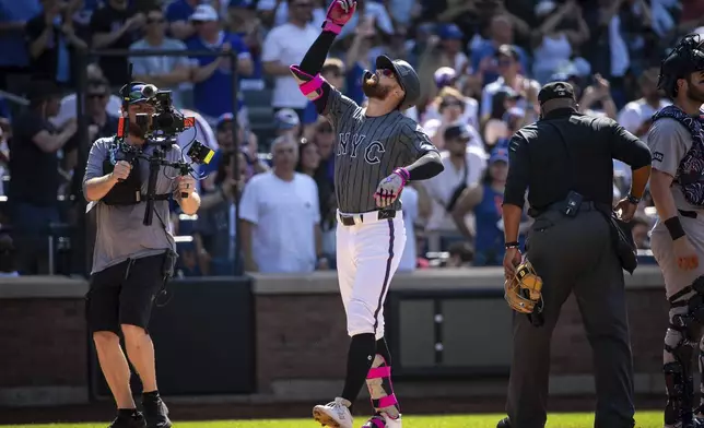 New York Mets' Brandon Nimmo celebrates his grand slam during the first inning of a baseball game against the New York Yankees, Saturday, July 5, 2025, in New York. (AP Photo/Angelina Katsanis)
