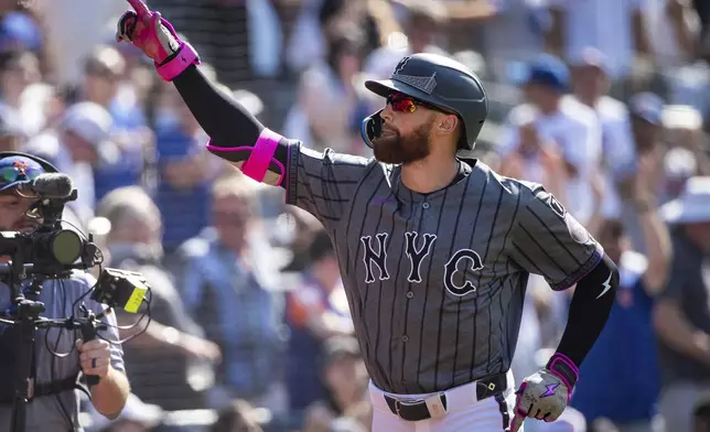 New York Mets' Brandon Nimmo celebrates after his grand slam during the first inning of a baseball game against the New York Yankees, Saturday, July 5, 2025, in New York. (AP Photo/Angelina Katsanis)