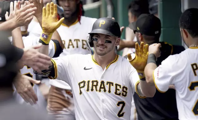 Pittsburgh Pirates' Spencer Horwitz celebrates in the dugout after hitting a grand slam during the second inning of a baseball game against the Detroit Tigers, Wednesday, July 23, 2025, in Pittsburgh. (AP Photo/Matt Freed)