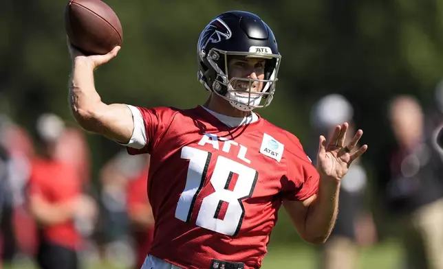 Atlanta Falcons quarterback Kirk Cousins (18) works out during a Atlanta Falcons training camp, Saturday, July 26, 2025, in Flowery Branch. (AP Photo/Mike Stewart)