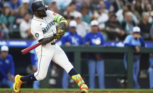 Seattle Mariners' Randy Arozarena hits a solo home run against the Kansas City Royals during the sixth inning of a baseball game Wednesday, July 2, 2025, in Seattle. (AP Photo/Lindsey Wasson)