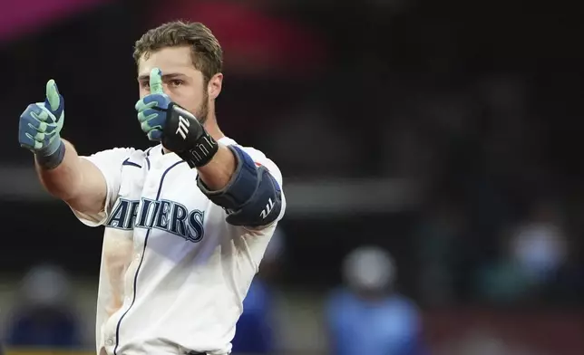 Seattle Mariners' Ben Williamson reacts after hitting a double against the Kansas City Royals during the seventh inning of a baseball game Wednesday, July 2, 2025, in Seattle. (AP Photo/Lindsey Wasson)