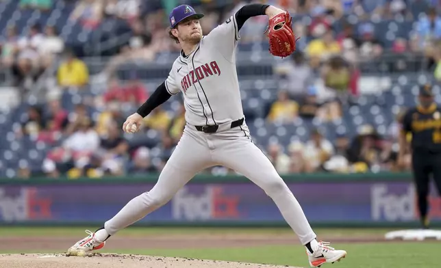 Arizona Diamondbacks pitcher Ryne Nelson delivers during the first inning of a baseball game against the Pittsburgh Pirates, Friday, July 25, 2025, in Pittsburgh. (AP Photo/Matt Freed)