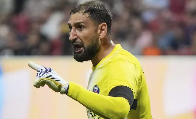 Paris Saint-Germain's goalkeeper Gianluigi Donnarumma argues to officials after the Club World Cup quarterfinal soccer match between PSG and Bayern Munich in Atlanta, Saturday, July 5, 2025. (AP Photo/Mike Stewart)